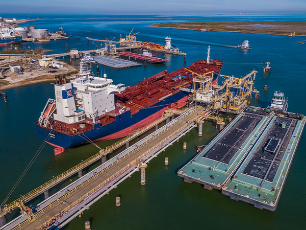 Barge and vessel at terminal